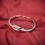 Swarovski Crystal Studded Interlocking Wave Kada in Rose Gold Plated 925 Sterling Silver